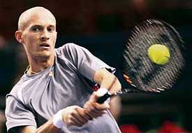 Russia�s Nikolay Davydenko returns the ball to compatriot Dmitry Tursunov during their match in the Paris Masters tennis tournament on Thursday