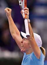 Belgium�s Justine Henin-Hardenne celebrates after beating Russia�s Maria Sharapova in the seminfinal of the WTA Tour Championships in Madrid on Saturday.