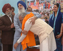 The Chief Minister of Haryana, Mr Bhupinder Singh Hooda, with the Director of Sant Singh Sukha Singh College, Amritsar, Mr Jagdish Singh, at the prize distribution function of the college on Sunday.