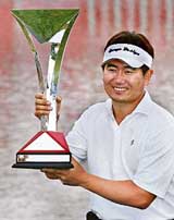 South Korea�s Yang Yong-Eun holds the trophy after winning the HSBC Champions golf tournament at the Sheshan Golf Club in Shanghai on Sunday