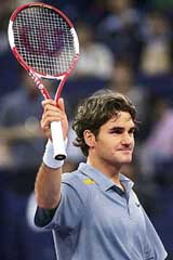 Switzerland�s Roger Federer celebrates his win over Argentina�s David Nalbandian during the opening match of the Masters Cup tennis tournament in Shanghai on Sunday