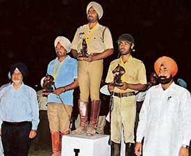 Punjab Animal Husbandry Minister Jagmohan Singh Kang (right) with winners of an event on the concluding day of the 3rd Punjab Horse Show and State Equestrian Championship at the Punjab Police Academy, Phillaur, on Sunday