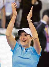 Belgium�s Justine Henin-Hardenne celebrates after beating France�s Amelie Mauresmo in the final of the end-of-season WTA Tour Tennis Championship in Madrid on Sunday