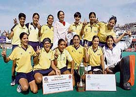 Northern Railway team pose with the trophy after winning the women�s section of the 10th Indian Oil Surjit Hockey Tournament in Jalandhar