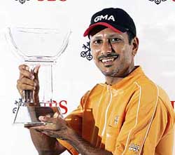 Jeev Milkha Singh with the Asian Tour�s UBS Order of Merit trophy at the Hong Kong Golf Club on Sunday. 