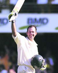 Australian captain Ricky Ponting celebrates his century during the first Ashes Test at the Gabba Stadium in Brisbane