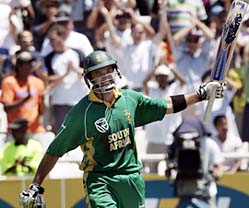 South Africa�s Justin Kemp celebrates after hitting a century during the third one-dayer against India in Cape Town on Sunday.