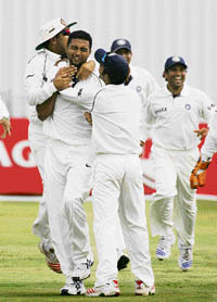 India�s VRV Singh celebrates with team-mates after dismissing Rest of South Africa�s Morne van Wyk on the third day of the warm-up match at Potchefstroom on Saturday