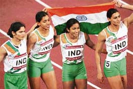 Members of the Indian women�s 4x400m relay team (from left) Pinki Pramanik, Sati Geetha, K Chitra and Manjeet Kaur celebrate after winning the gold medal at the Khalifa Stadium in Doha