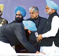 Prime Minister Manmohan Singh with Punjab Chief Minister Amarinder Singh at a public rally in Amritsar on Wednesday.