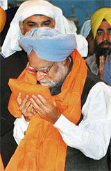Prime Minister Manmohan Singh after receiving a siropa at the Golden Temple in Amritsar on Wednesday.