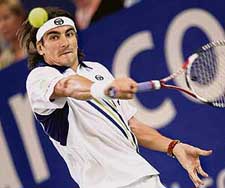 Tommy Robredo of Spain plays a return during his match against Croatian Mario Ancic at the Hopman Cup in Perth on Monday.