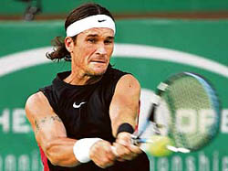 Carlos Moya of Spain in action against German  Alexander Waske during their first round match at the Chennai Open in Chennai on Tuesday. Moya won 7-6, 6-3. � AFP photo