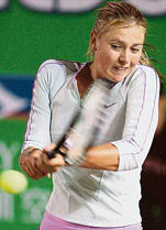 Maria Sharapova of Russia hits a return against Yan Zi of China in the quarterfinals of the Watson�s Water Tennis Championships in Hong Kong on Thursday. Sharapova won 7-5, 6-3. � AFP photo