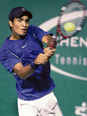 Karan Rastogi plays a return shot to Rafael Nadal of Spain during their second round match in the Chennai Open on Thursday.  Nadal won 6-4, 6-1. � AFP photo