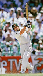 Australia�s Shane Warne hits a boundary during the third day of the fifth and final Ashes Test in Sydney on Thursday. � Reuters photo