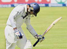 Rahul Dravid walks back to the pavilion after being dismissed by South Africa�s Paul Harris on the fourth day of the third Test at Cape Town on Friday. 