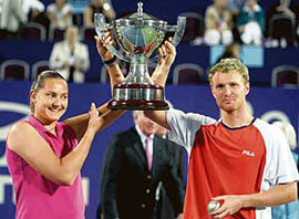 Nadia Petrova (left) and Dmitry Tursunov of Russia hold the Hopman Cup after defeating Spain�s Anabel Medina Garrigues and Tommy Robredo in the final in Perth on Friday. 