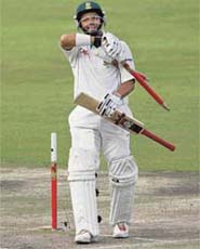 Ashwell Prince picks up the stumps after scoring the winning run