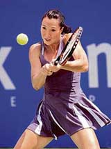 Jelena Jankovic of Serbia hits a shot against Samantha Stosur of Australia during their second round match at the Sydney International tournament on Tuesday
