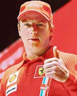 Ferrari Formula One driver Finland�s Kimi Raikkonen poses for the first time in Ferrari�s colors during a press conference