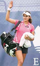 Sania Mirza waves to the crowd after winning her quarterfinal match against Australia�s Alicia Molik in the Hobart International tournament on Wednesday. Mirza won 6-4, 6-1. 