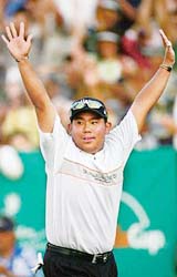 Sixteen-year-old Tadd Fujikawa of Hawaii rejoices after making a birdie putt during the Sony Open in Honolulu