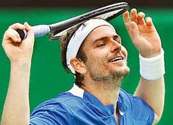 Mardy Fish of the US celebrates after beating Ivan Ljubicic of Croatia in a first round match at the Australian Open in Melbourne