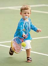 Rocco Piatti (3) plays tennis with his dad Riccardo Piatti, coach of Croatia's Ivan Ljubicic, at the Australian Open in Melbourne