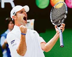 Andy Roddick of the US celebrates after winning his match against Marc Gicquel of France at the Australian Open in Melbourne