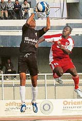 Churchill Brothers' goalkeeper Vinay Singh is airborne to thwart JCT striker Edeh Chidi's move in a 11th National Football League match at Ludhiana's Guru Nanak Stadium