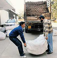 Workers unload publicity material at the Congress Bhavan, Sector 15, Chandigarh, on Friday.