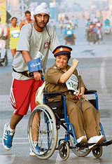 A paraplegic dressed as a cop takes part in the Mumbai Marathon on Sunday.
