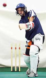 Spanish tennis player Tommy Robredo tries his hand at batting at the Melbourne Cricket Ground on Monday. Robredo will play defending champion Roger Federer in the quarterfinals of the Australian Open on Tuesday.