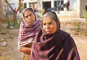Waiting for their voices to be heard over the election din, Manjit Kaur, mother of missing five-year-old Sheru, and another relative in Buchar Kalan village in Tarn Taran district