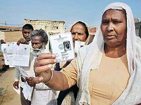 Beant Nagar residents show their voter identity cards in Bathinda