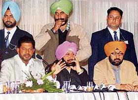 Chief Minister Amarinder Singh, flanked by Mr Satnam Singh Kainth (right) and Mr Jassi Khangura, addresses a press conference in Ludhiana
