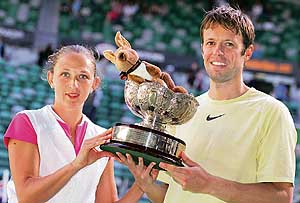 Russia�s Elena Likhovtseva (left) and Canada�s Daniel Nestor hold the trophy after winning the mixed doubles final against Max Mirnyi and Victoria Azarenka of Belarus at the Australian Open in Melbourne on Sunday. 