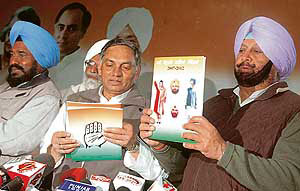 General secretary of the AICC Janardhan Diwedi releases the Congress manifesto at Punjab Congress Bhavan in Chandigarh