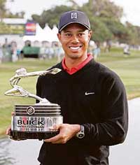 Tiger Woods holds the trophy after winning the Buick Invitational PGA Golf Tournament in La Jolla, California, on Sunday. 