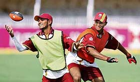 West Indies� Denesh Ramdin and Shivnarine Chanderpaul play with a rugby ball during a training session in Vadodara