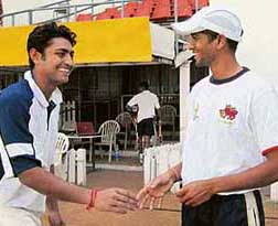 Bengal captain Deep Dasgupta (left) with Mumbai skipper Amol Muzumdar during a practice session on the eve of the Ranji Trophy Super League final at the Wankhede Stadium in Mumbai on Thursday.