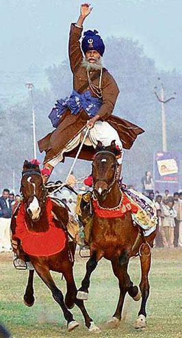 Nihang Maggar Singh exhibits his skills during the Kila Raipur Games on Friday.