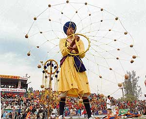 A young nihang displays his martial art skills at the Kila Raipur games on Saturday. 