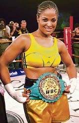 American boxer Laila Ali shows her WBC super-middleweight title belt after knocking out Guyana�s Gwendolyn O�Neill at the Emperor�s Palace in Johannesburg on Saturday. 