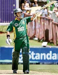 South Africa�s Mark Boucher celebrates after scoring a half-century during the first one-day match against Pakistan in Johannesburg on Sunday.