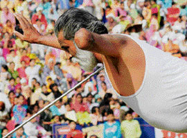 Bheem Singh, a physically challenged man from Sangrur, bends an iron rod on the concluding day of the Kila Raipur Games on Sunday.