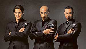 Swiss tennis icon Roger Federer (left), American golf legend Tiger Woods (right) and French footballer Thierry Henry strike a pose after the announcement of their endorsement deal with shaving giant Gillette at a function in Dubai 