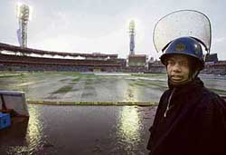 A policeman on duty at the Eden Gardens in Kolkata on Thursday. The first one-dayer between India and Sri Lanka was abandoned due to rain. 