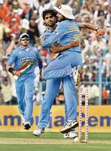 Munaf Patel (left) celebrates with Harbhajan Singh after taking the wicket of Sri Lanka�s Upul Tharanga during the first one-dayer in Kolkata on Thursday. 